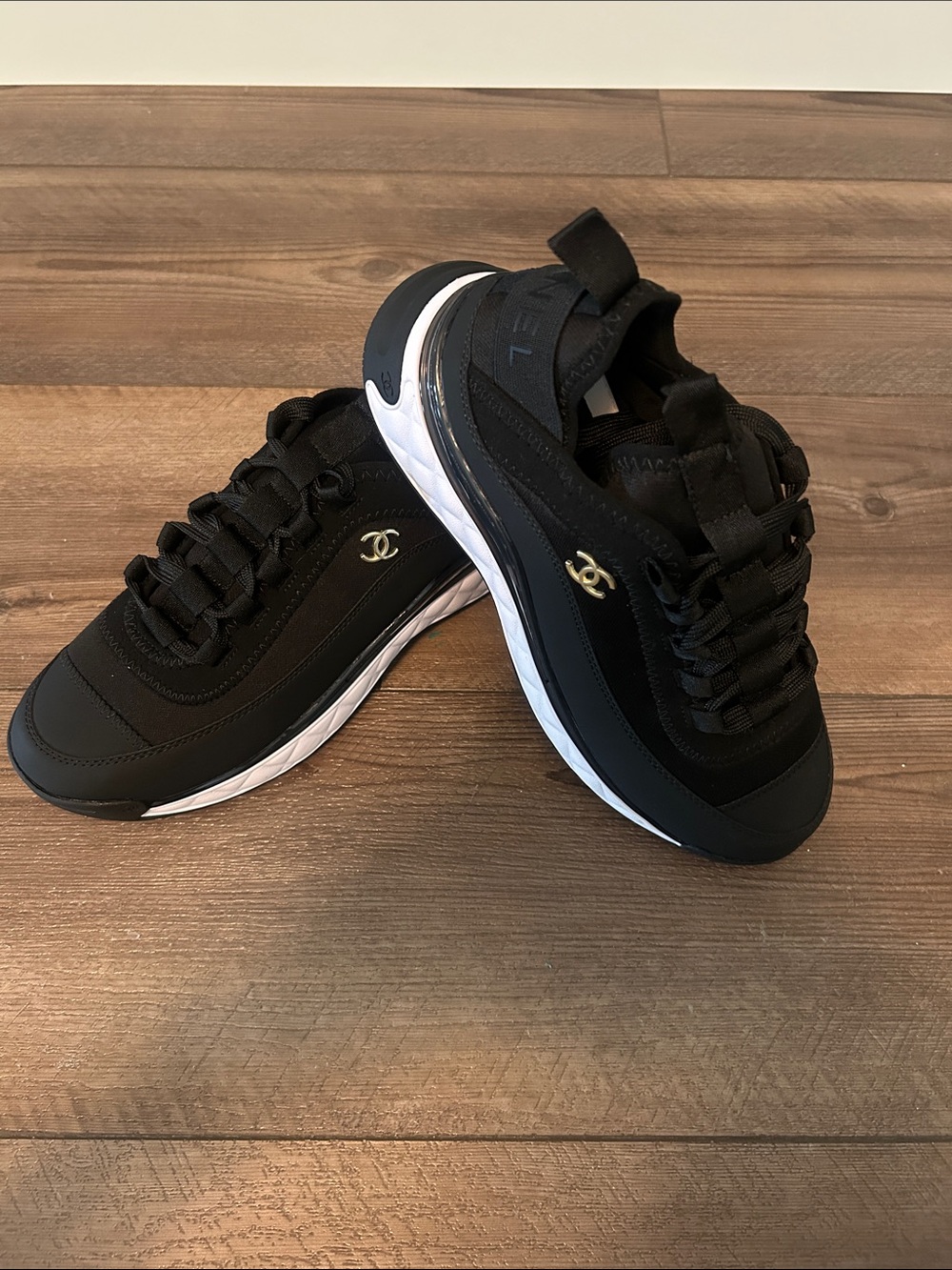 CHANEL Black Sneakers with White Sole and Gold Logo